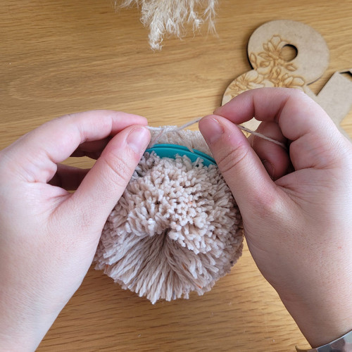 Nouer le pompon